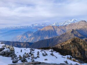 Scenic view of the snow-covered Himalayan mountains from Tungnath, India, showcasing natural beauty.